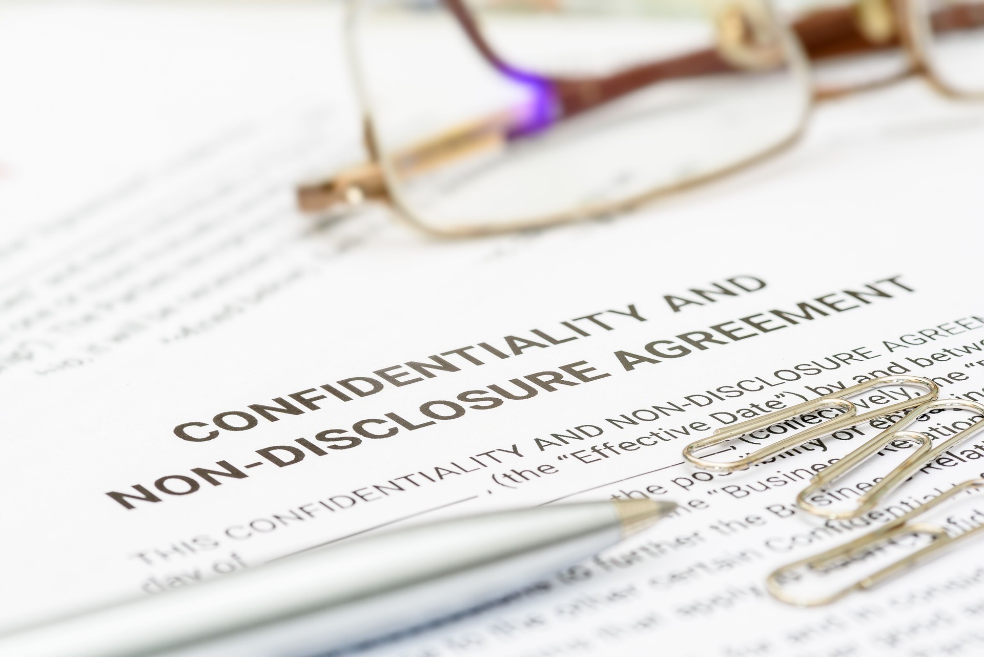 A confidentiality and non-disclosure agreement form safeguards sensitive information, outlining obligations, exceptions, and remedies.