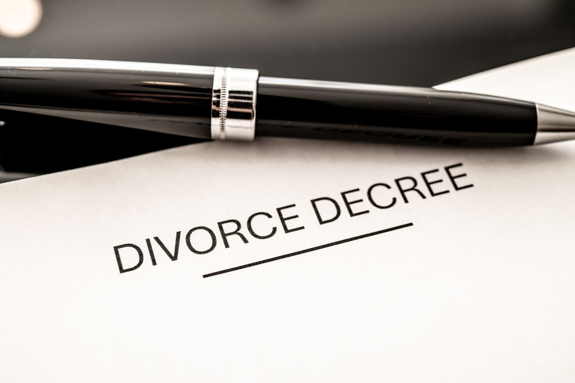 Legal Divorce Decree Document Close-Up with Fountain Pen, Representing Marital Separation and Legal Proceedings, Symbolizing Divorce Settlement and Finalization Process